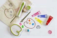 an assortment of crafting supplies on a white surface