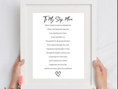 two hands holding up a framed print with the poem to my step mom on it