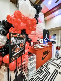 the nike store is decorated with black, white and red balloons