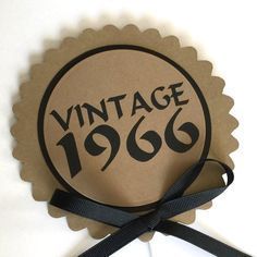 an old - fashioned badge with the words vintage 1960 on it and a black ribbon