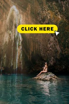 a woman sitting on a rock in front of a waterfall with the words click here