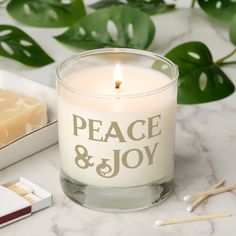 a candle sitting on top of a table next to matches