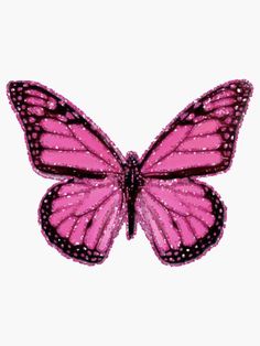 a pink butterfly with black dots on it's wings