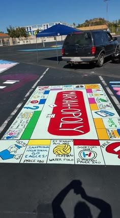 a parking lot with a large sign painted on it