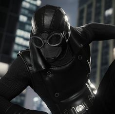 a man in a black leather outfit and goggles