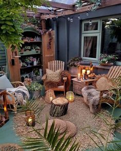 an outdoor area with chairs, tables and candles