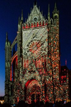 a large cathedral lit up with christmas lights