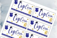 four blue and gold popcorn labels with the words popcorn on them