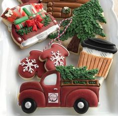 decorated cookies in the shape of cars and trees