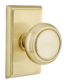 an antique brass door handle with a round knob on the front and side of it