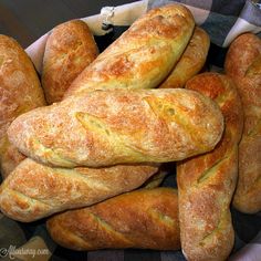 a basket filled with loaves of bread