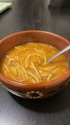 a bowl of soup is sitting on a table