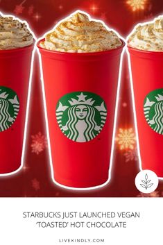 three red starbucks cups filled with whipped cream and topped with starbuck's just launched vegan toasted hot chocolate