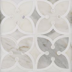 a white and grey tile with circles on it