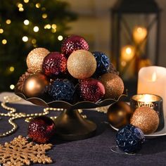 a table with candles and ornaments on it