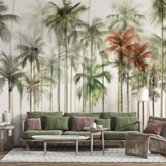 a living room with palm trees on the wall and couches in front of it