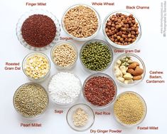 seven bowls filled with different types of beans and nuts, all labeled in the following words