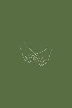 two hands touching each other on a green background