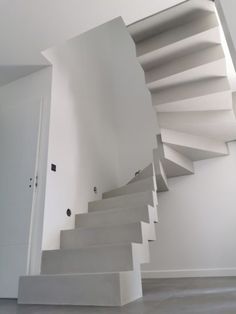 there is a white staircase in the house