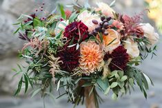 a bouquet of flowers sitting on top of a table