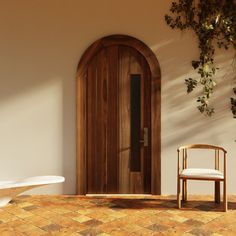 a chair sitting in front of a wooden door next to a table and potted plant