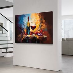 a wine glass and bottle on a table with grapes in front of it, next to some stairs