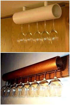 several wine glasses are hanging from the wall