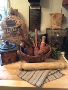 a basket filled with lots of different types of cooking utensils on top of a wooden table