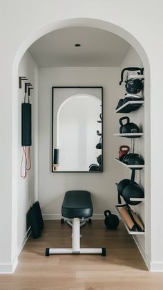 a room that has some shoes on the floor and a mirror above it with shelves