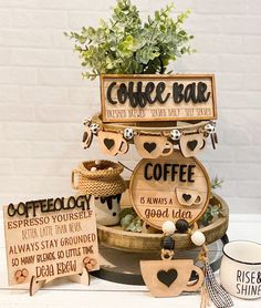 there is a coffee bar sign on the table with other signs and decorations around it