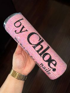 a person holding up a pink can with the word yolop on it's side