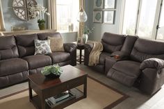 a living room with two couches and a coffee table