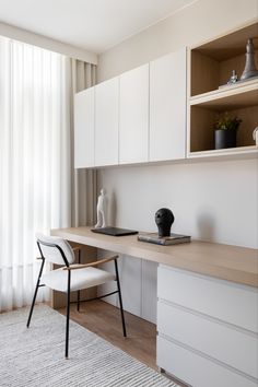 the interior of a home office with white cabinets and wood flooring is featured in an ad