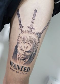 a man with a tattoo on his leg that says wanted dead or alive and two swords