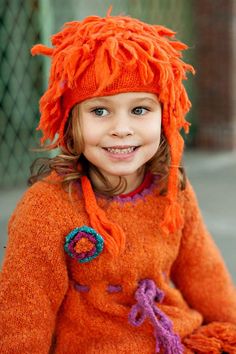 Fuzzy, furry, fabulous. This earflap beanie hat is the epitome of fun. Perfect for cold days or for ski trips, this beanie is made with warm acrylic material that is soft on your little one’s ears. Lots of fringe adds some pizazz while the strings can be tied for a more snug style. Pair it with a heavy coat for protection against the elements or with a cute top and legging for a standout accessory. This hat comes in red, orange, black, burgundy, pink, and light pink. After, hand wash and lay it Earflap Beanie, Kids Winter Hats, Ski Trips, Heavy Coat, Winter Hats Beanie, Acrylic Fabric, Winter Beanie, Ski Trip, Cute Top