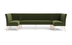 a green couch with two wooden legs sitting on top of it's back end