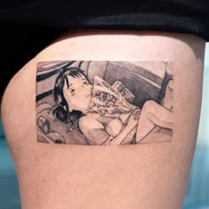 a woman's thigh with a drawing of a girl eating pizza