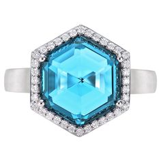 This is fancy Swiss Blue Topaz Ring in hexagon briolette shape purple hue. The Ring is elegant and can be worn for many occasions. The Swiss Blue Topaz around the ring add to the beauty and elegance of the ring. Swiss Blue Topaz Fancy Ring in 18Karat White Gold with White Diamond. Swiss Blue Topaz: 6.76 carat, 12X12mm size, Hexagon briolette shape. White Diamond: 0.14 carat, 1.00mm size, round shape, G color, VS clarity. Gold: 4.76g, 18Karat White Gold. R1628 Swiss Blue Topaz Ring, Fancy Rings, Naha, Swiss Blue Topaz, Purple Hues, Blue Topaz Ring, Topaz Ring, White Diamond, Blue Topaz