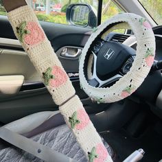 the steering wheel cover is decorated with flowers