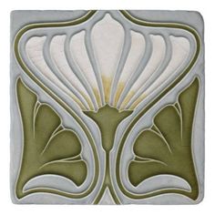 an art deco tile design in green and white