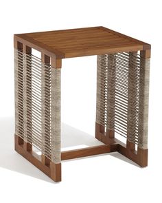 the side table is made out of wood and has wicker strips on it's sides