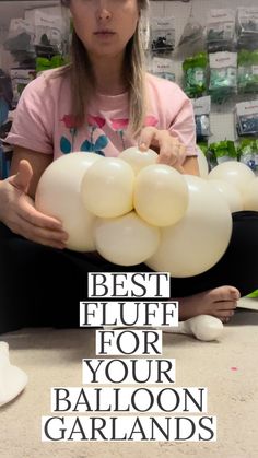 a girl holding balloons in her hands with the caption best glue for your balloon garlands