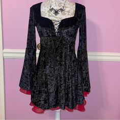 Widow Vampire Victorian Goth Velvet Dress Size Medium. Mannequin Is A Small. I’d Say This Would Fit A Small Better I Think. As There Is No Stretch Under The Bust. There Is A Zipper To Get This On Easier New With Tags. Msrp: $68 Tulle Lining, Long Flare Sleeves, Scoop Neck, Front Tie Up, Ruched Bust With Lace Trim, Side Zip Closure. Perfect For A Vampire Look Or Romantic Goth Outfit. This Is A Dream Bag Honestly. Dollskill Alt Alternative Emo Grunge Witchy Romantic Black Moon Child Coffin Bat Sku Velvet Vampire, Romantic Goth Outfits, Vampire Victorian, Vampire Look, Bat Skull, Vampire Dracula, Goth Outfit, Dream Bag, Clothes Items