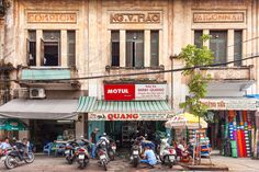 motorcycles parked in front of an old building