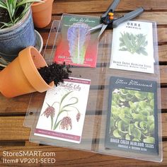 plants and seed catalogs sitting on a table