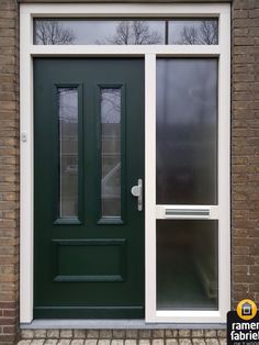 a green front door with two sidelights