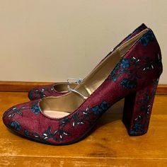 Absolutely Gorgeous Chunky Heel Pumps In A Burgundy/Wine Shade With Blue Floral Designs. Round Toe. No Longer Have The Original Box. Only Worn To Try On. Measurements: The Inside Of The Heel To The Bottom Is 3”, And From The Outside Of The Heel To The Bottom Is 3.5”. Fabric High Heel Heels For Formal Occasions, Fabric Block Heel Shoes For Formal Occasions, Formal Fabric High Heel Shoes, Formal Fabric Block Heel Shoes, Formal Fabric High Heels, Formal Closed Toe Fabric Heels, Fabric High Heels For Fall, Burgundy Closed Toe Synthetic Heels, Burgundy Closed Toe Heels For Spring