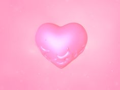 a pink heart shaped object on a pink background