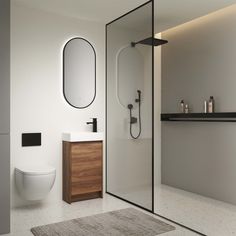 a bathroom with a toilet, sink and shower stall in it's own area