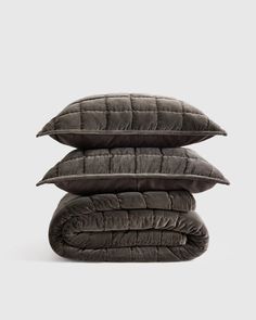 three pillows stacked on top of each other